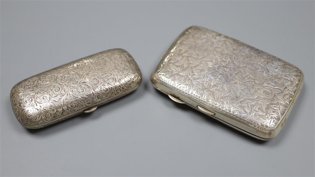 A silver cigarette case and a Victorian silver cheroot holder, 79mm.